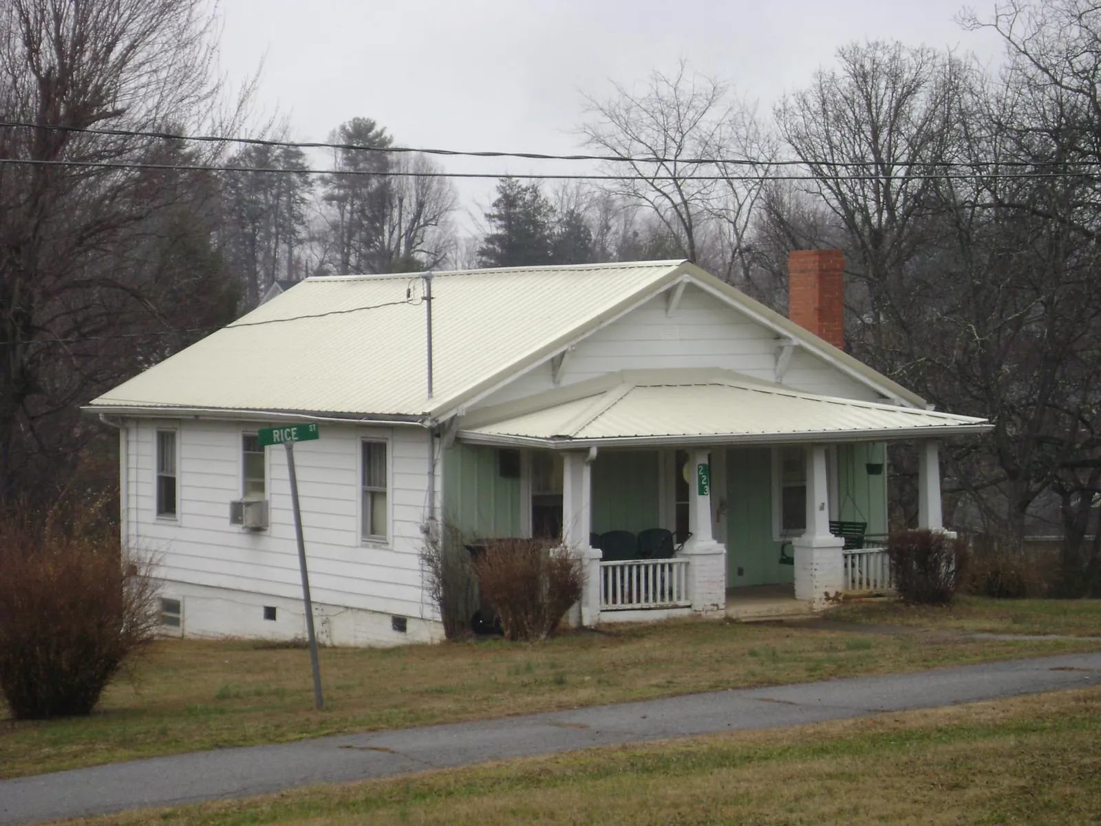 White metal roof on a craftsman bungalow at a street corner in Parkesburg